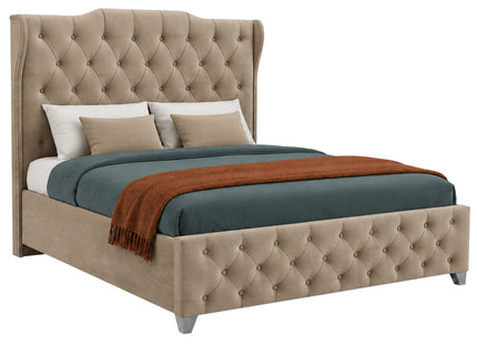 A tufted wingback bed ottoman divan bed upholstered in beige fabric, styled with a dark teal duvet, two beige pillows, and a rust-orange throw blanket, shown on a solid white background.