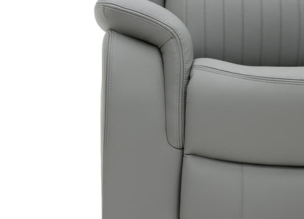 Close-up of a light grey upholstered recliner chair showing the armrest, side panel, and vertical channel stitching on a white background.